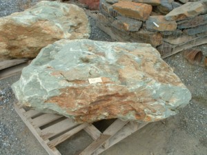 Photo of 49er brown Boulder. Use in landscaping. Natural stone sold by Rolleri Landscape Products.