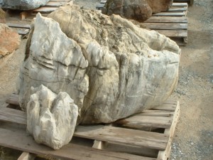 Photo of Limestone Weathered Boulder. Use in landscaping. Natural stone sold by Rolleri Landscape Products.
