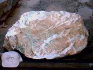 Photo of Mariposite Boulder. Use in landscaping. Natural stone sold by Rolleri Landscape Products.