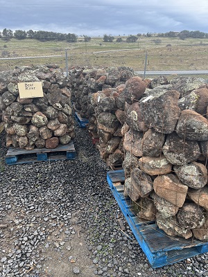 Photo of Bear River Moss Rock. A  Feildstone with lichen and moss used for Drystack stone wall, and Masonry Stone Wall. Natural stone sold by Rolleri Landscape Products.