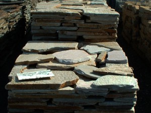 Photo of Salmon Quartzite Patio Tumbled flagstone. A natural stone product of Rolleri Landscape Products.