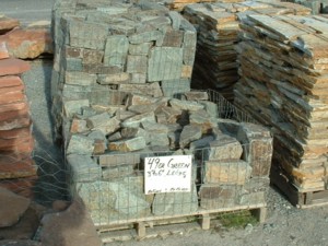 Photo of 49er Green 3 in to 6 in natural Ledgestone. Use in Drystack wall, Masonry stone wall, Landscape natural stone wall, or Hardscape natural stone wall. Natural stone sold by Rolleri Landscape Products.