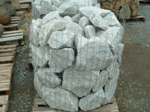Photo of White Broken Granite Wall Rock. For Dry-stack, Masonry, or Landscaping wall stone. Natural stone sold by Rolleri Landscape Products.
